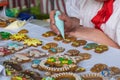 Girl paints homemade honey cakes Medovnik