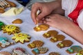 Girl paints homemade honey cakes Medovnik