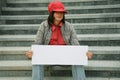 Girl with a paper for the announcement in hand