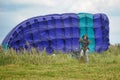 Girl with a parachute after landing Royalty Free Stock Photo