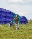 Girl with a parachute after landing Royalty Free Stock Photo