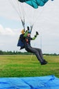 The girl-parachutist lands on airdrome