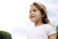 Girl with in park with blue sky.