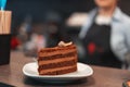 Girl pastry chef serves chocolate cake