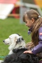 Girl patting dog