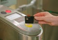 The girl pays for travel in the Moscow metro with a Tinkoff bank card. Royalty Free Stock Photo