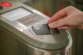 The girl pays for travel in the Moscow metro with a Tinkoff bank card. Royalty Free Stock Photo