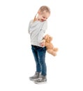 Girl peaking on a teddy, isolated Royalty Free Stock Photo