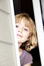 Girl Peeking Out Door Royalty Free Stock Photo