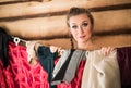 Girl peeks out from behind the wardrobe