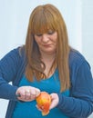 Girl peeling an apple.