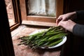 Girl peeling asparagus Royalty Free Stock Photo