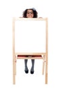 Girl peeping from behind white blank board Royalty Free Stock Photo