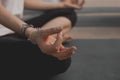Girl performing yoga meditation close up shot on hand and sitting position