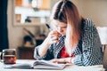 Girl performs a school task at home-distance learning during the coronavirus pandemic.