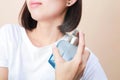 Girl with perfume, young beautiful woman holding bottle of perfume and smelling aroma Royalty Free Stock Photo