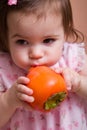 Girl with persimmon