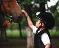 Girl petting horse