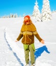 Girl photo of a man in a beautiful mountain snowy landscape.