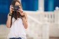 Girl photographer with professional SLR camera Royalty Free Stock Photo