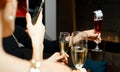 Girl Photographs Three Glasses With White, Red Wine, Champagne