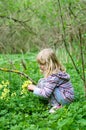 Girl picking cowslip flower