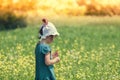 Girl picking flowers on the meadow Royalty Free Stock Photo