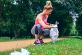 Girl picking up trash doing plogging Royalty Free Stock Photo