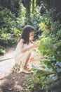 Girl picks flowers in the forest