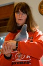 Girl with a pigeon at the animal shelter