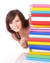 Girl with pile colored book .