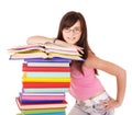 Girl with pile colored book . Royalty Free Stock Photo