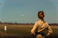 Girl pilot escorts an old plane at the airfield Royalty Free Stock Photo