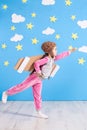 Girl pilot playing with toy jet pack at home. Success and leader concept Royalty Free Stock Photo