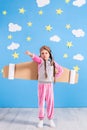 Girl pilot playing with toy jet pack at home. Success and leader concept Royalty Free Stock Photo