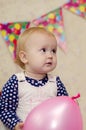 Girl with pink balloon