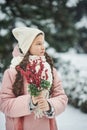 Girl in pink coat in snow Park. Girl plays in winter Park. Adorable child walking in snow winter forest Royalty Free Stock Photo