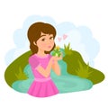 Girl in pink dress kissing a frog prince with crown Royalty Free Stock Photo