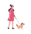 Girl in pink dress walking with funny dog. A child in casual clothes holding a puppy on a leash. An active walk in the