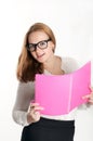 Girl with a pink folder on light background