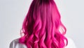 A girl with pink hair, beautiful curls. Salon styling. New hairstyle