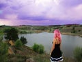 Girl with pink hair goes on a trip to the mountains Royalty Free Stock Photo