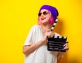 Girl with pink hair holding movie clapper Royalty Free Stock Photo