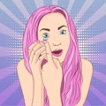 The girl with pink hair inserts, puts contact lenses in the eye. Pop art background. Imitation of comics style. Raster