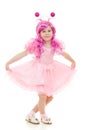 A girl with pink hair in a pink dress dancing Royalty Free Stock Photo