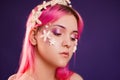 girl with pink hair and professional make-up sea princess with starfish and shells on her face and head