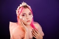 girl with pink hair and professional make-up sea princess with starfish and shells on her face and head