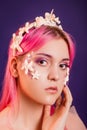 girl with pink hair and professional make-up sea princess with starfish and shells on her face and head