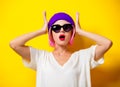 Girl with pink hair in purple hat and sunglasses Royalty Free Stock Photo