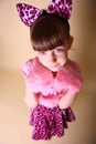 Girl in pink kitten outfit Royalty Free Stock Photo